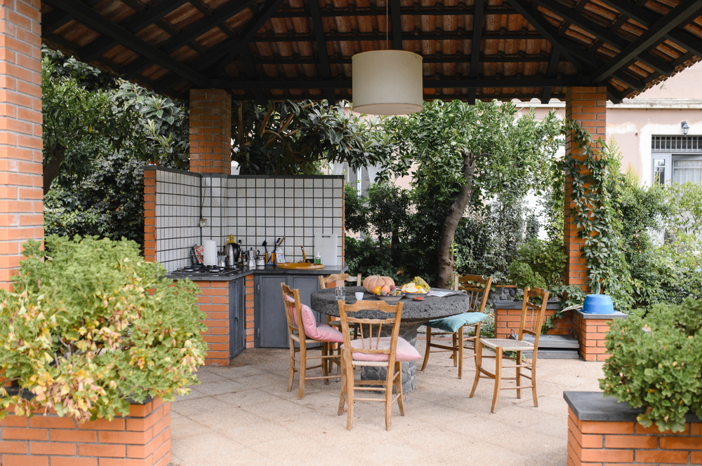 Contact Southern Love Landscaping for expert guidance on completing your outdoor kitchen with a stunning pergola.