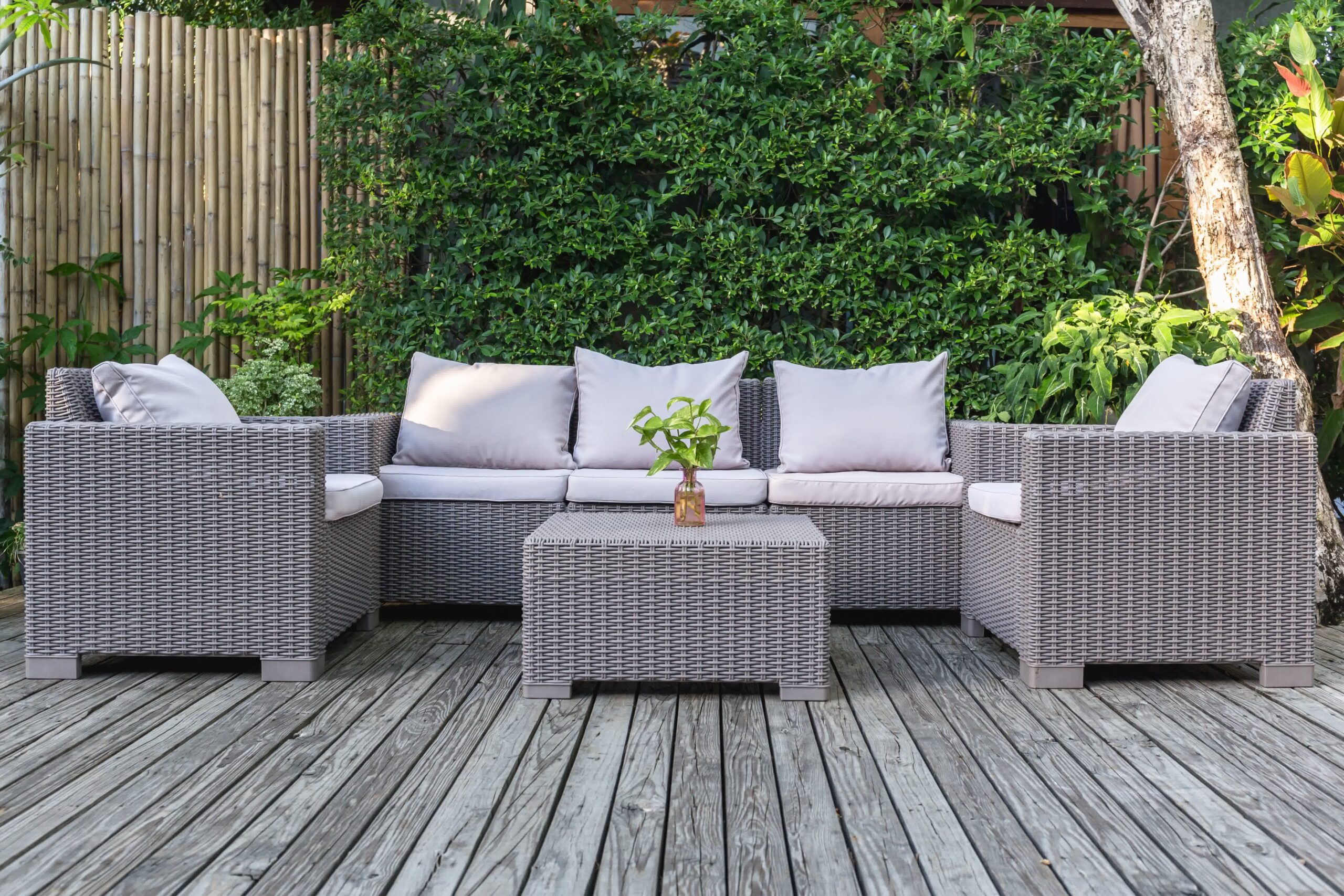 A gray color-themed deck with a matching furniture set.